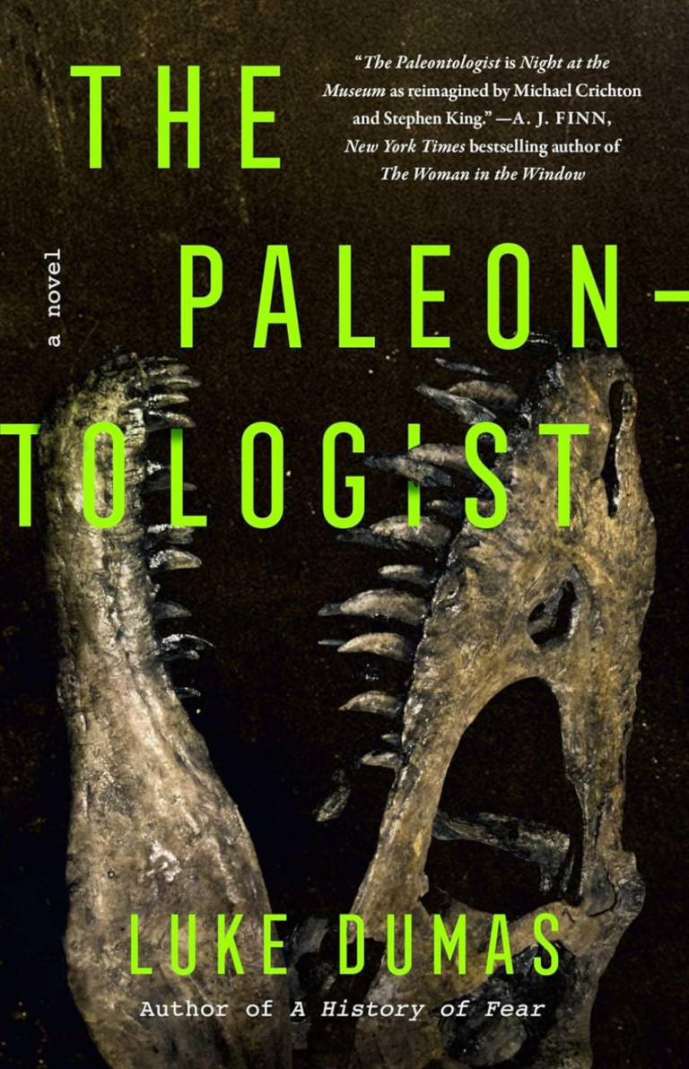 Book cover for The Paleontologist by Luke Dumas. The design features a dark, moody nighttime scene inside a natural history museum. In the foreground, a large Tyrannosaurus rex skeleton looms dramatically under dim overhead lighting, its massive skull and open jaws casting shadows. Behind it, faint silhouettes of other dinosaur skeletons and museum display cases are visible in a cavernous hall. The title 'The Paleontologist' appears in bold, white, slightly distressed lettering at the top, with the author's name 'Luke Dumas' in smaller white text below. The overall color palette is deep blacks, grays, and subtle blues with eerie highlights, evoking a sense of mystery and supernatural horror.