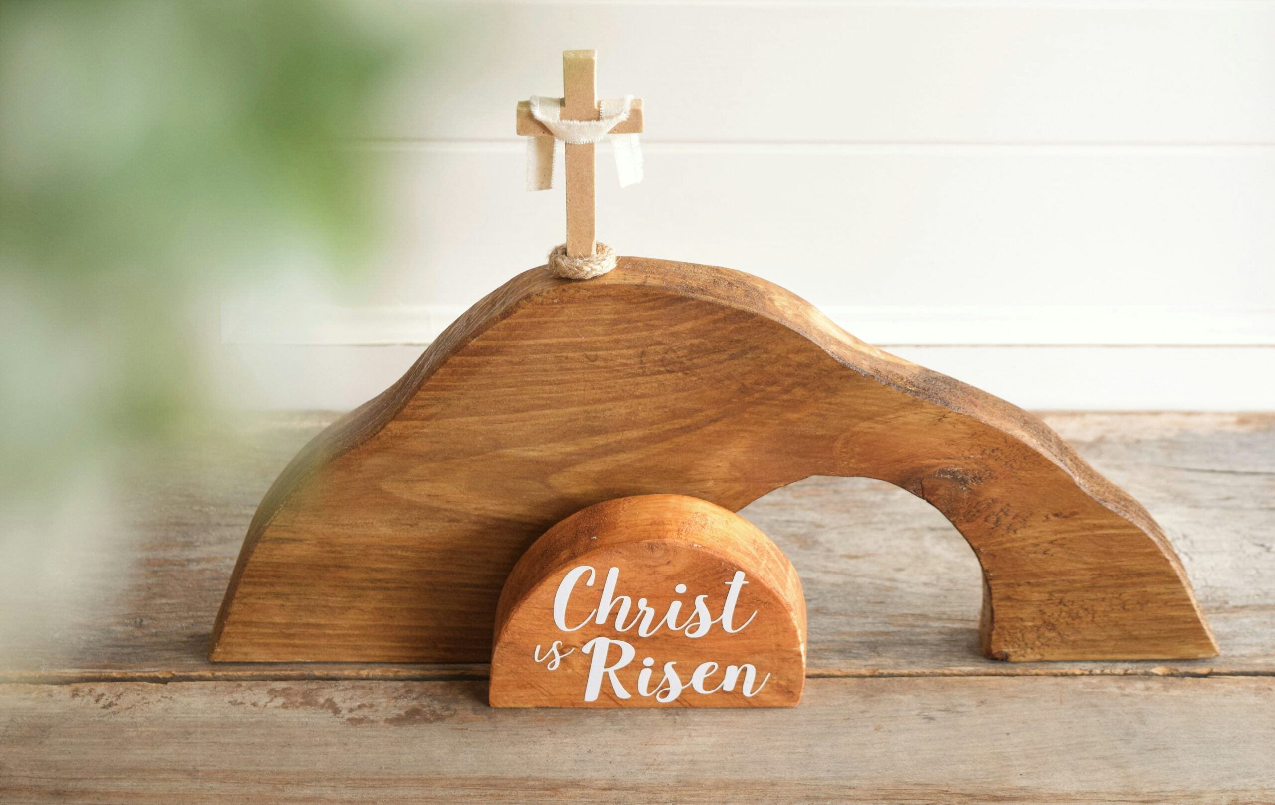 “a wooden cross on top of a wooden stand” by Ch Photography Published on March 21, 2023 NIKON CORPORATION, NIKON D3300 Free to use under the Unsplash License