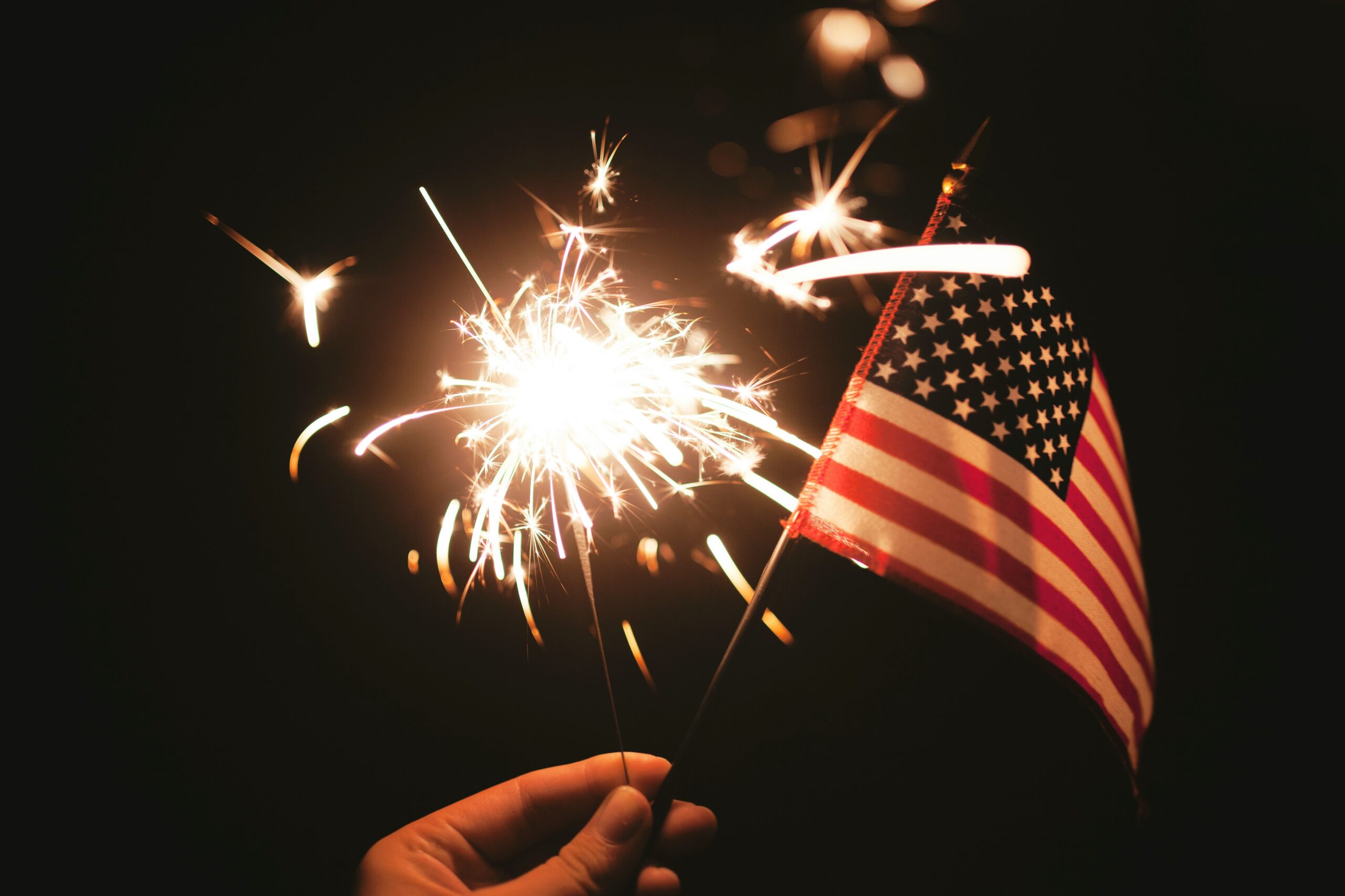 “time lapse photography of sparkler and U.S.A flag let” by Stephanie McCabe. Published on July 5, 2015. Camera: Canon, EOS 5D Mark II. Free to use under the Unsplash License.