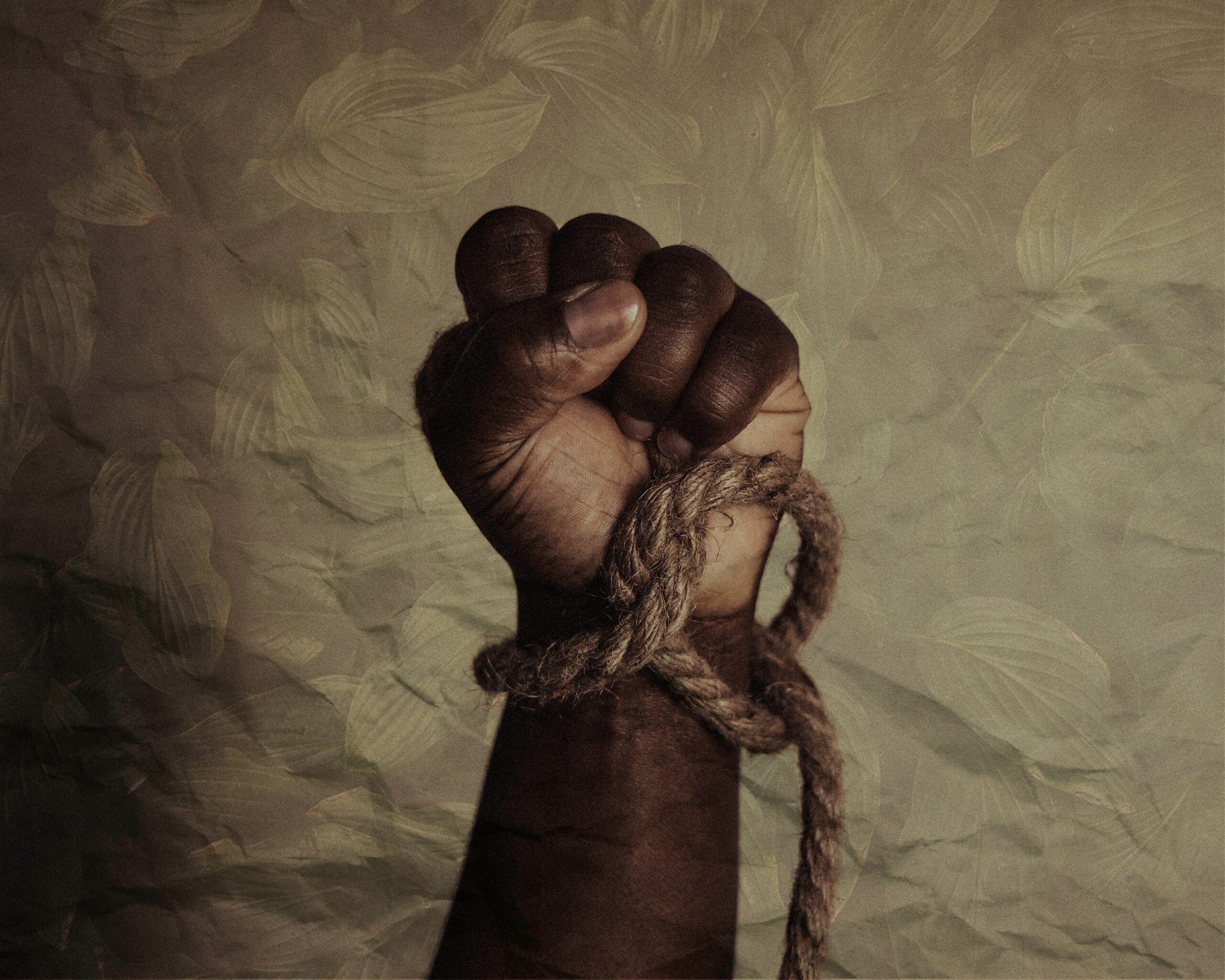 “brown leather strap on white textile” by Tasha Jolley. Black power of the celebration of Juneteenth, now a national Holiday. Texas, USA. Published on June 19, 2021. Camera: Canon, EOS R. Free to use under the Unsplash License.